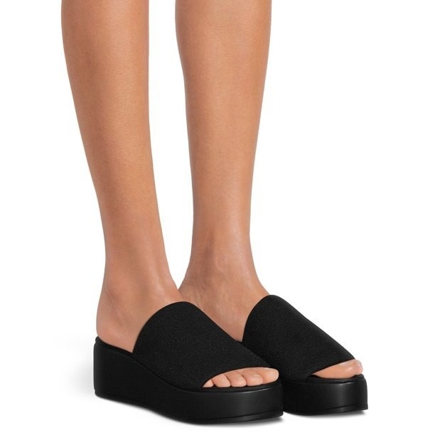 model wearing the black sandals