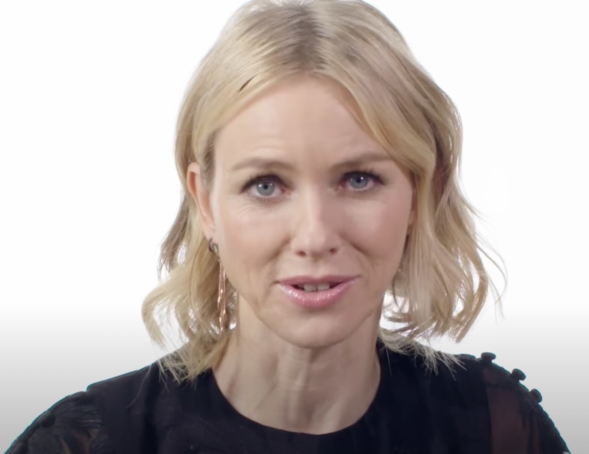 Naomi Watts raises her eyebrows and stares straight ahead