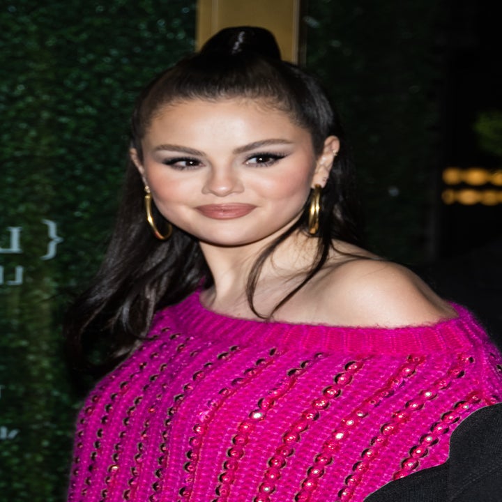 A closeup of Selena in a sequined sweater