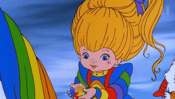 Rainbow Brite sending a rainbow out of her hands