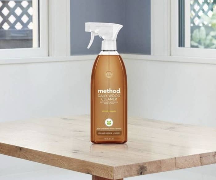 A bottle of wood cleaner on a wooden table