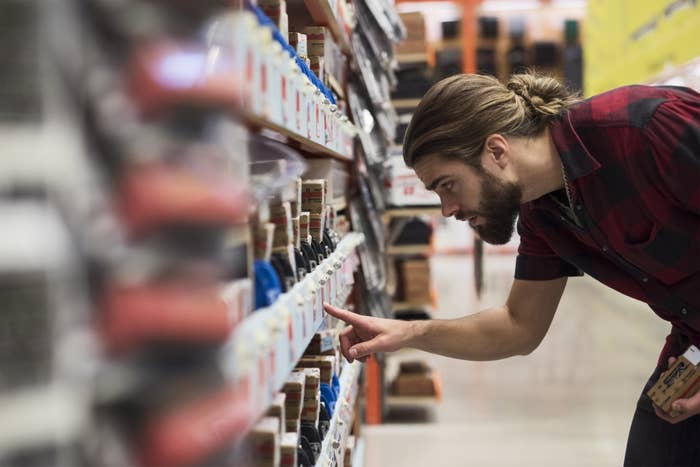 Man scans aisle at wholesale store