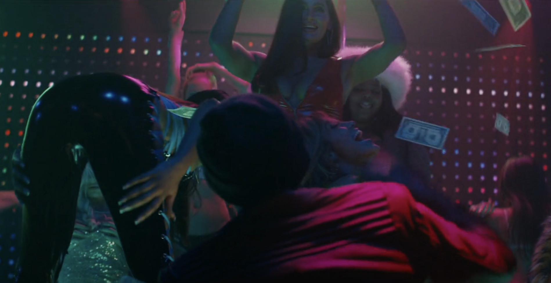 Usher throwing money on stage to performers in &quot;Hustlers&quot;