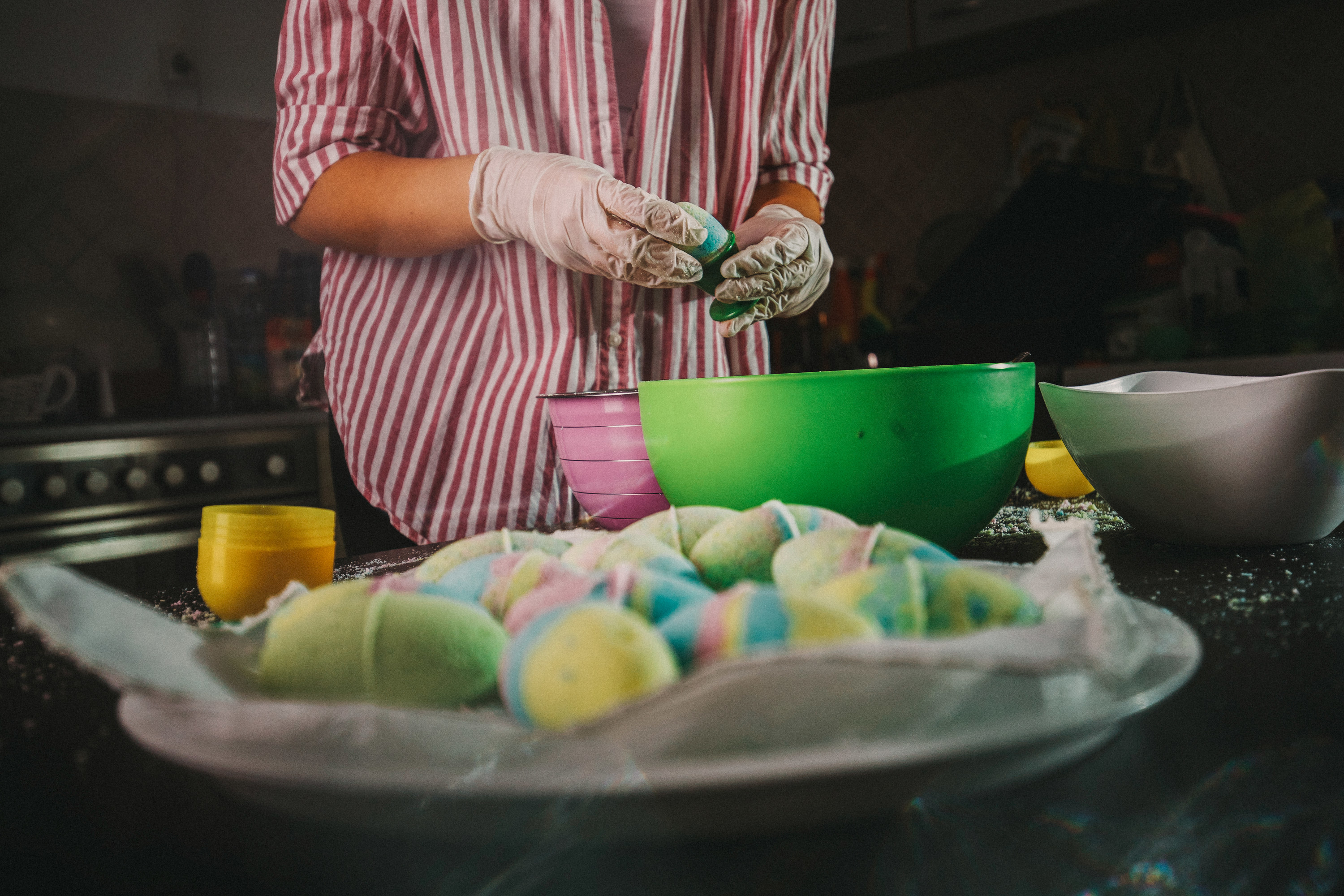 person makes bath bombs
