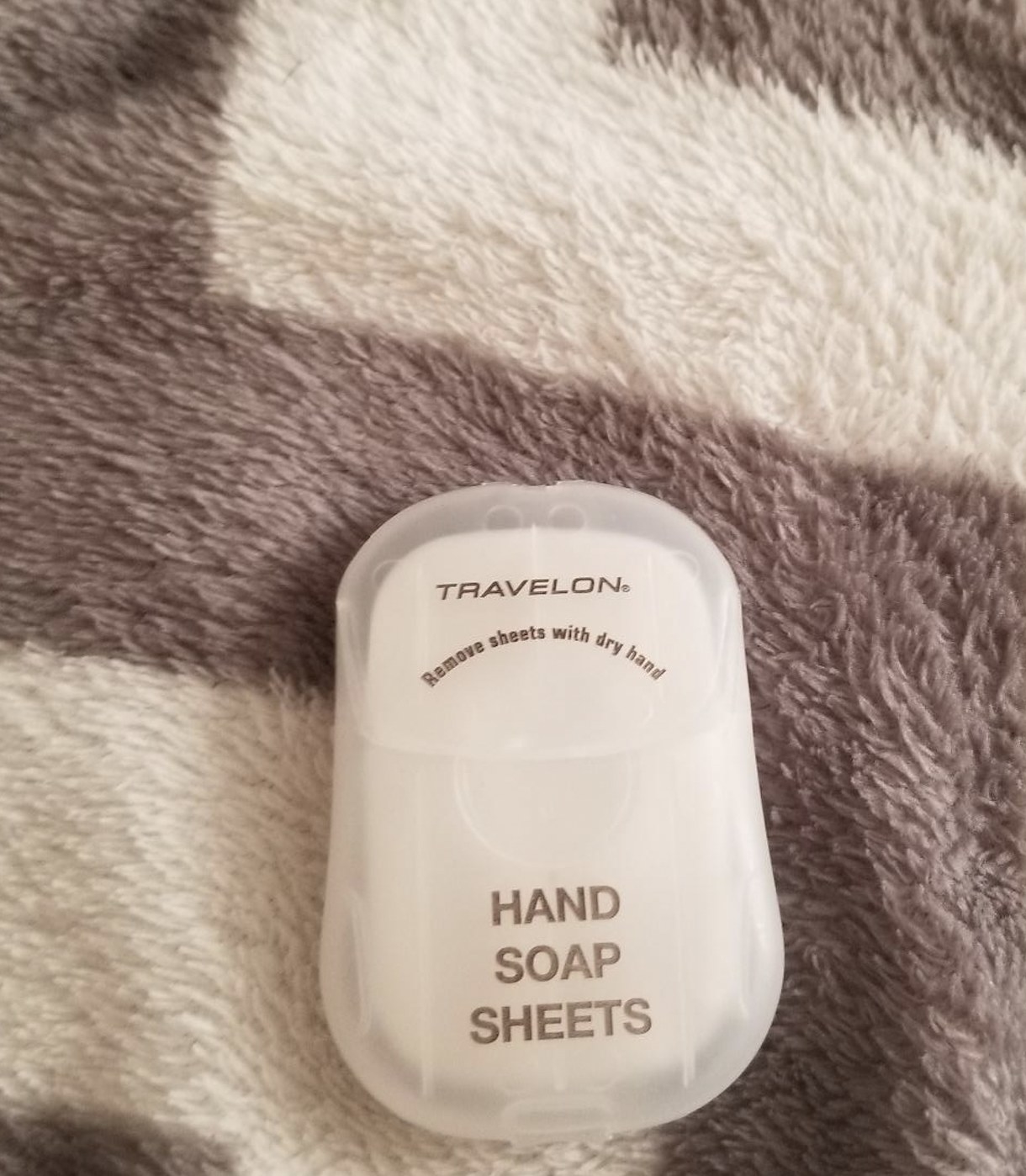 The hand soap sheets in pocket-sized dispenser case