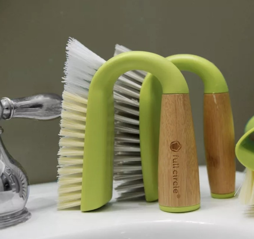 Two green and bamboo tile scrub brushes