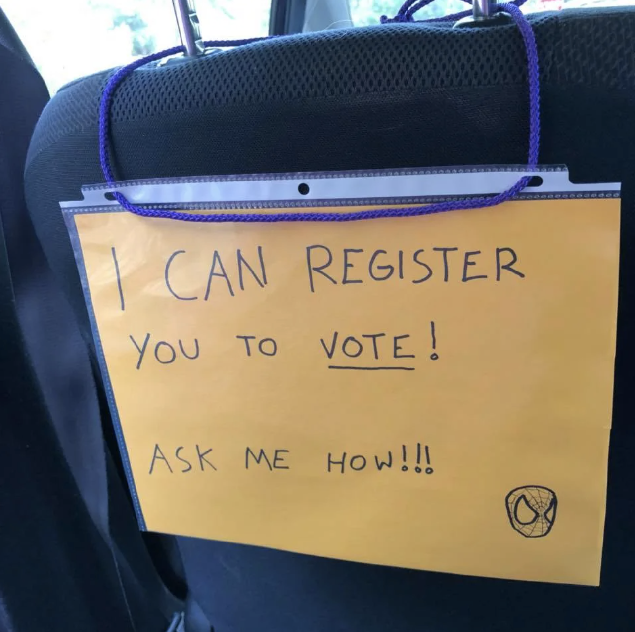 sign that reads, i can register you to vote