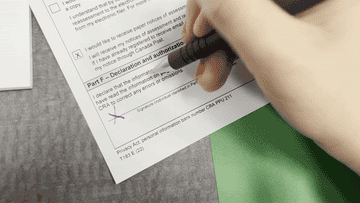 author signing a form