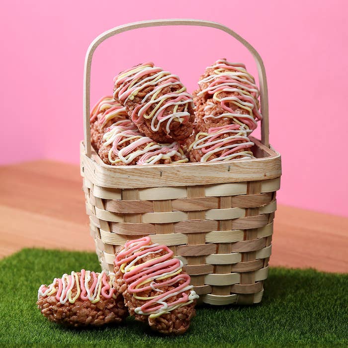 crispy rice eggs in a basket on pink background