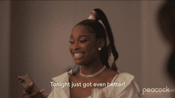 Coco Jones as Hilary Banks looking at her phone and saying, &quot;Tonight just got even better&quot;