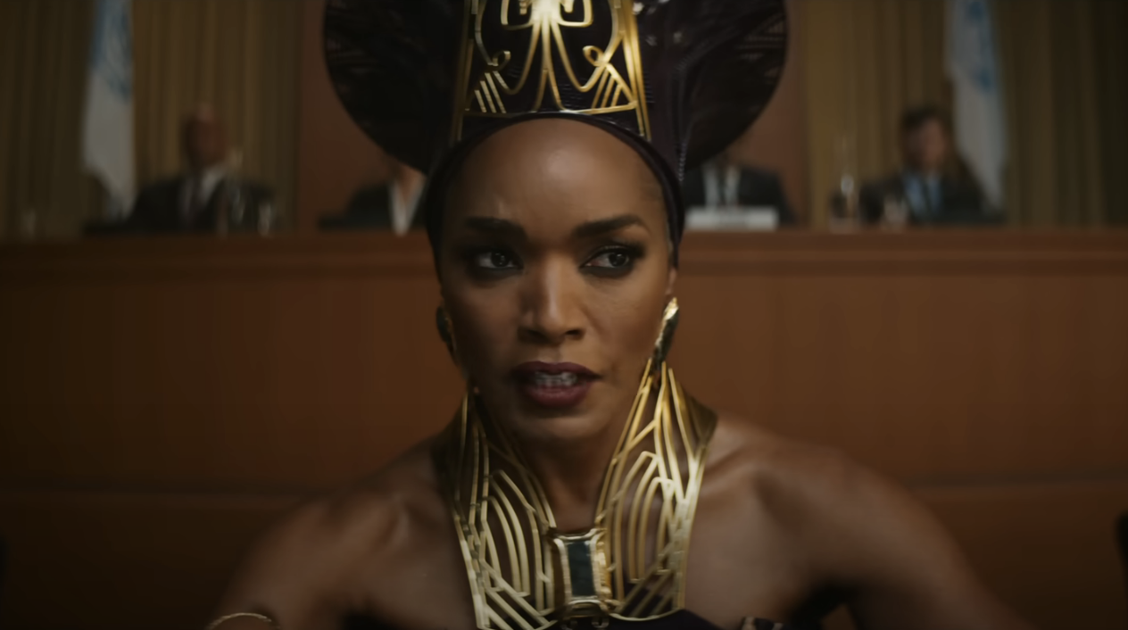 Angela Bassett sits and speaks as Ramonda in Black Panther: Wakanda Forever