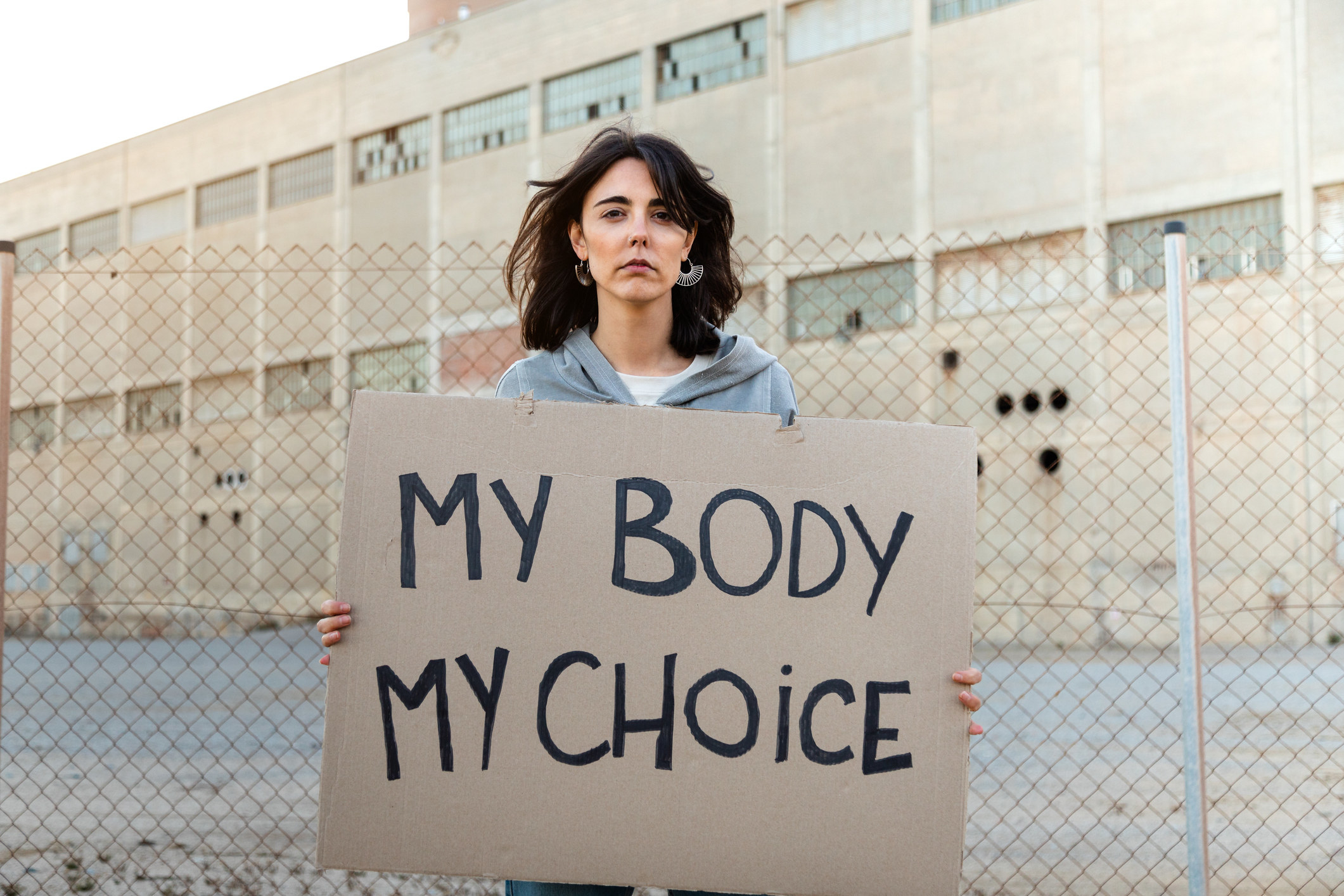 Woman holding a &quot;My body, my choice&quot; sign