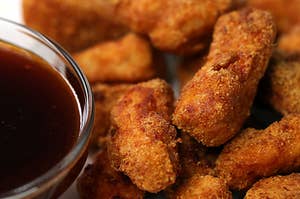 Chicken nuggets on a plate with sauce
