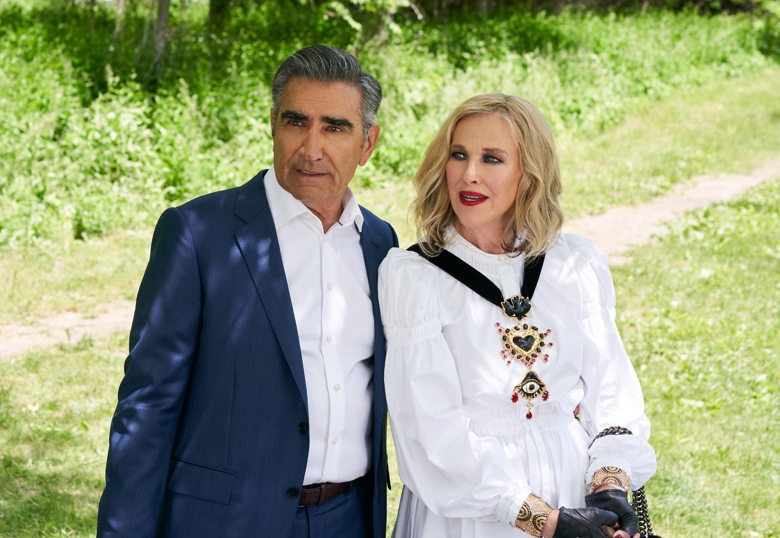 Eugene stands in a grassy field in Schitt&#x27;s Creek