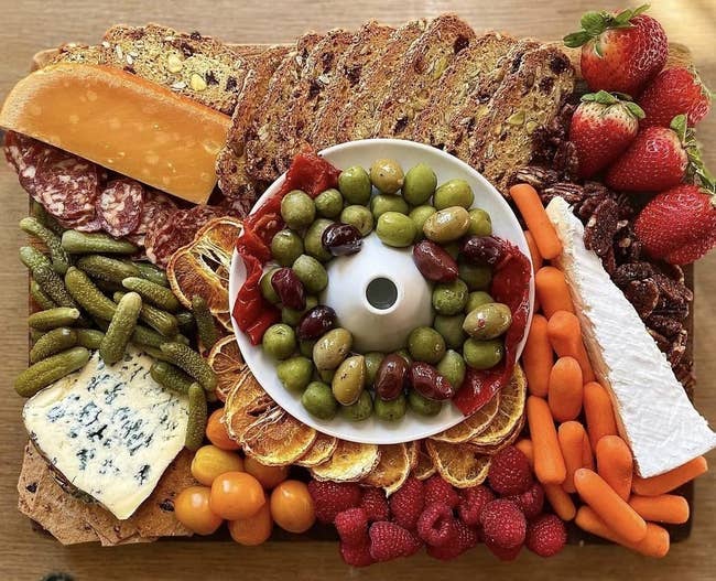 white olive and boat port with olives on a cheese board