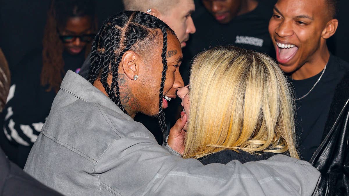 A series of photos show the rapper and singer/songwriter kissing during Fashion Week. Rumors have been swirling about a relationship since February.