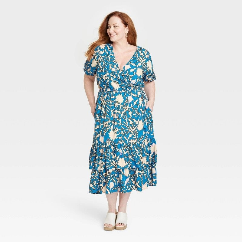 A model in the dress in blue floral