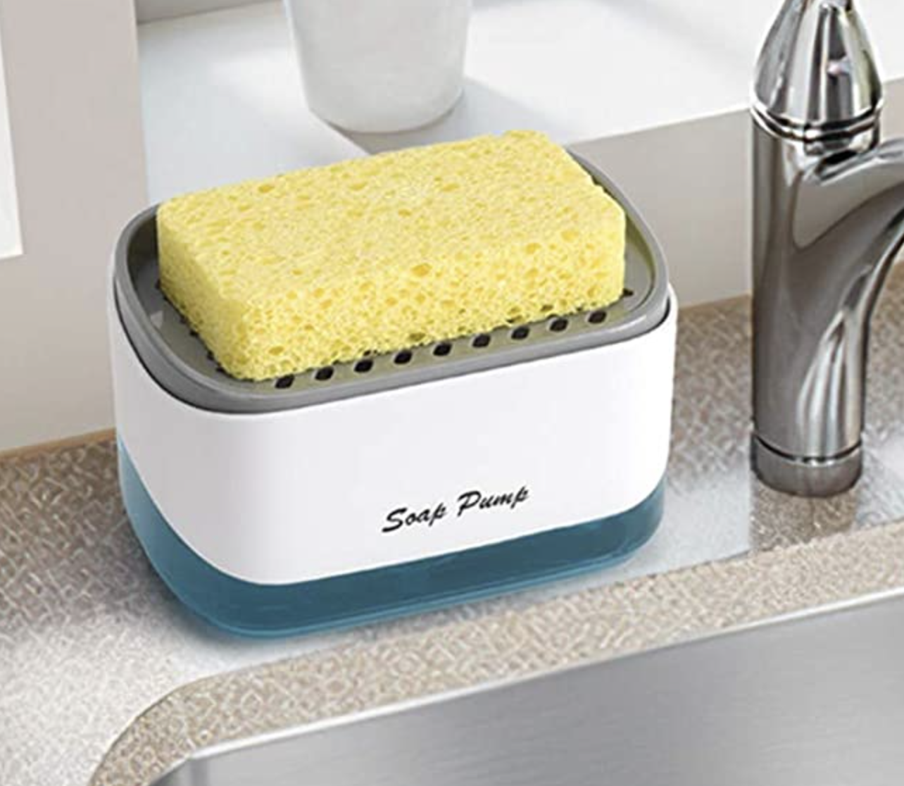 the soap dispenser with a sponge on it next to a kitchen sink