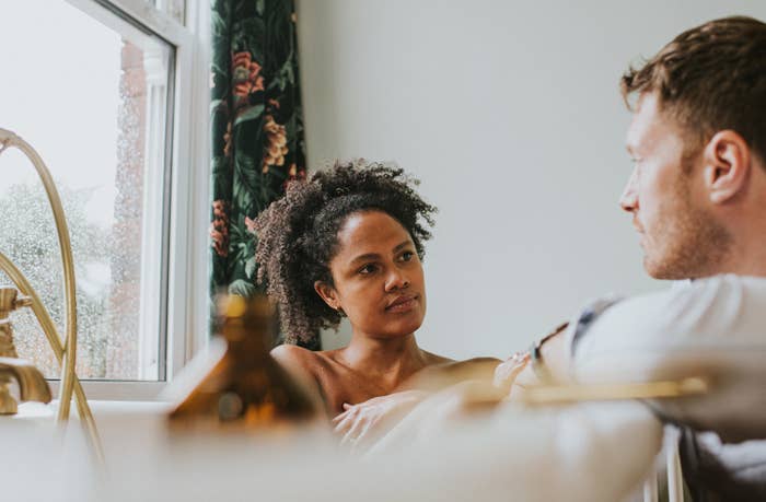 A couple talking inside their home