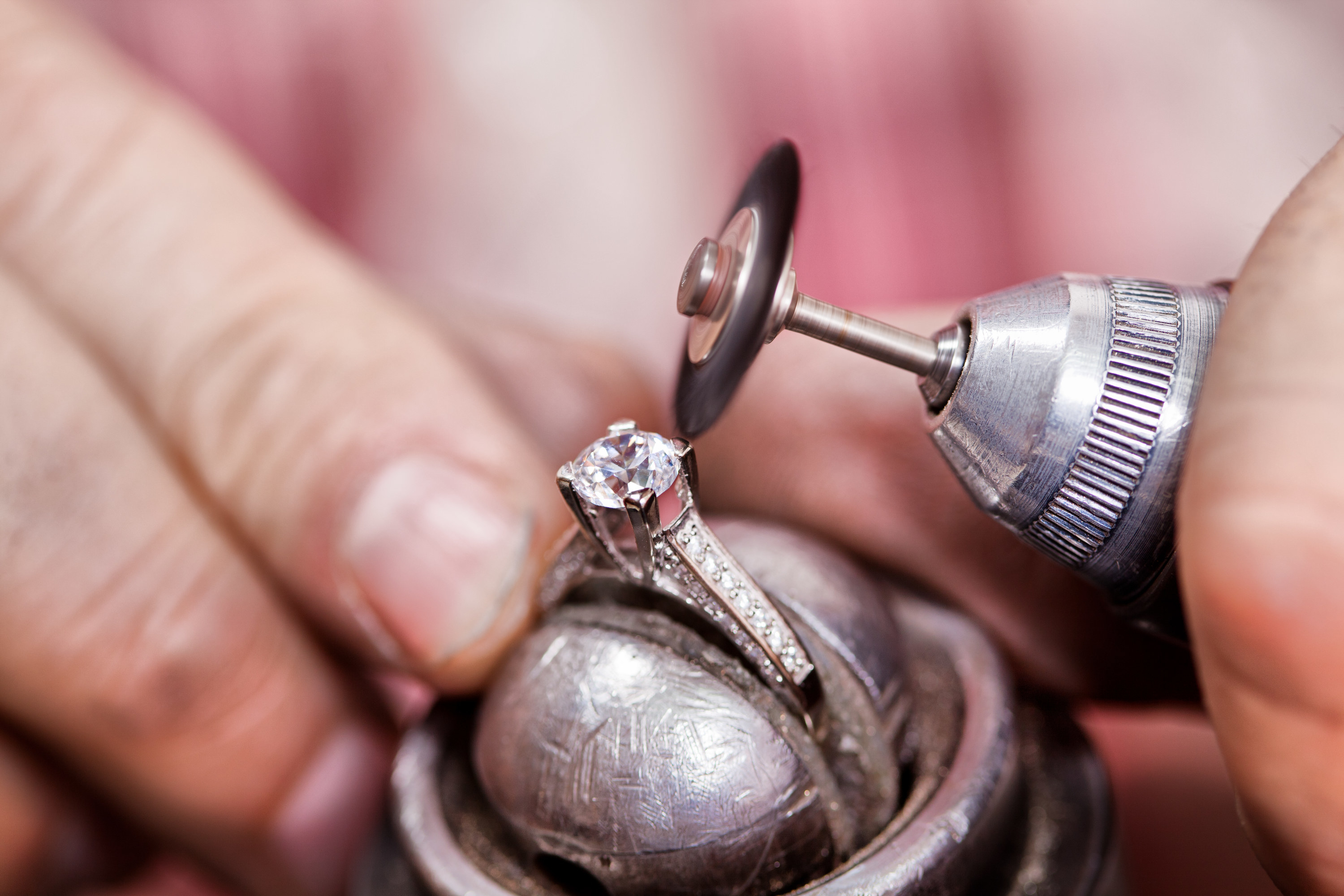 Jeweler polishing the diamond ring
