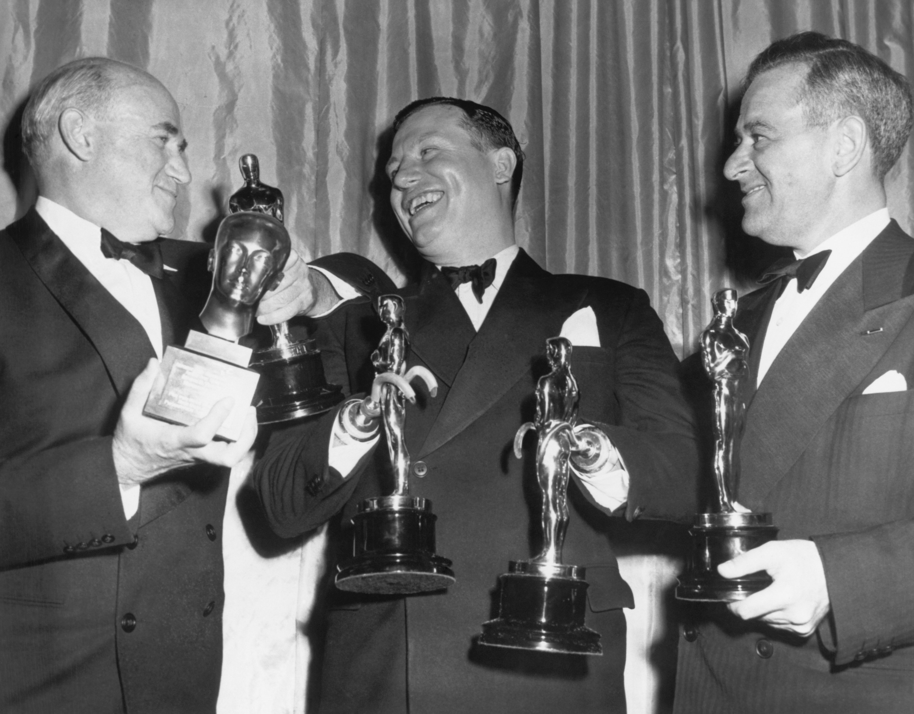 Harold holding both Oscars at the ceremony