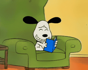 Snoopy reads a book and laughs in a &quot;Peanuts&quot; scene