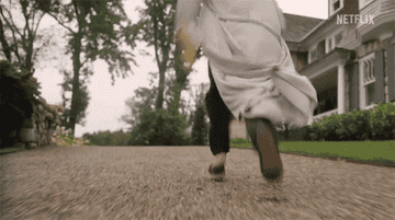 man running outside of the watcher house