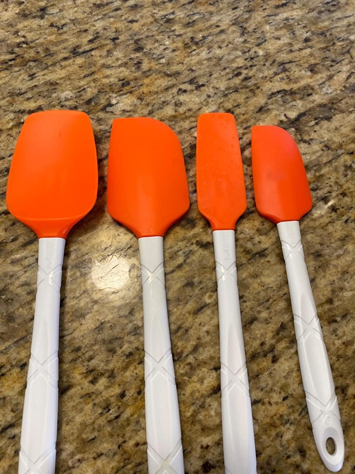 Reviewer image of four orange spatulas