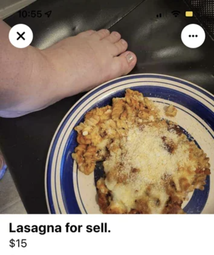 A plate of lasagna with a bare foot next to it for sale for $15