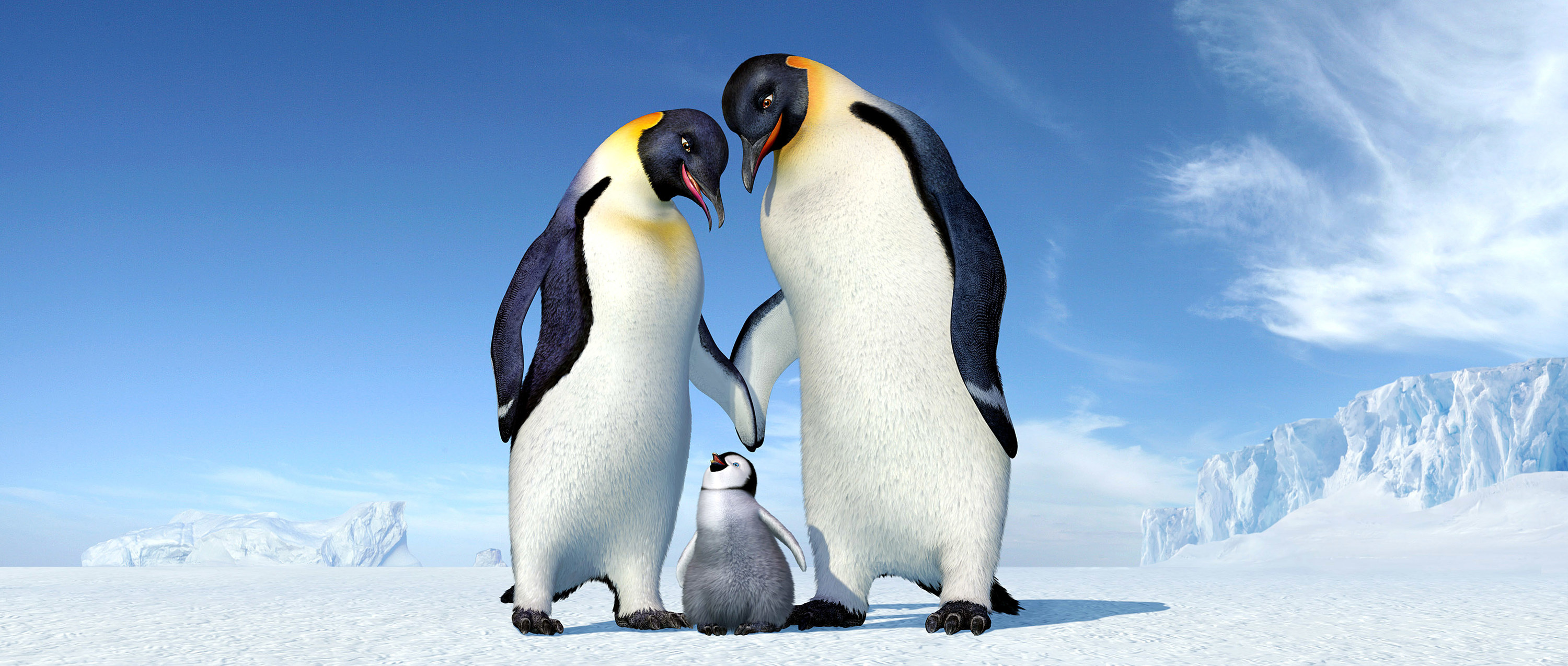 Three penguins stand together