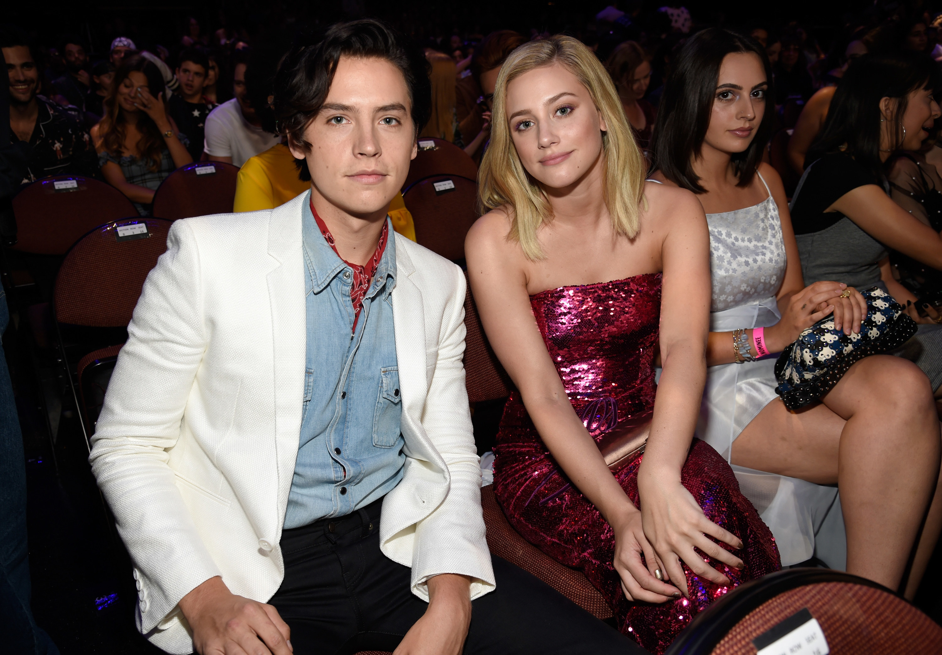 cole and lili sitting together at an event