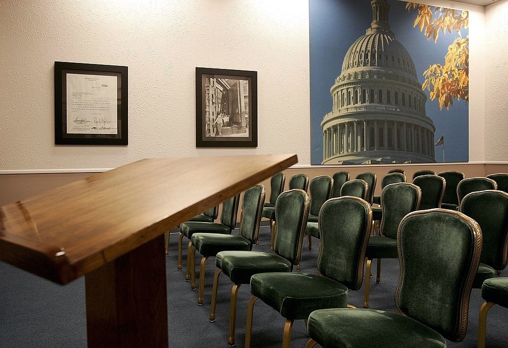 A room with a podium and chairs