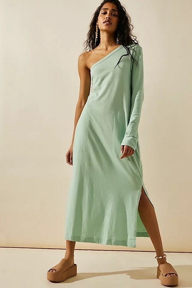 Model wearing green dress with brown shoes