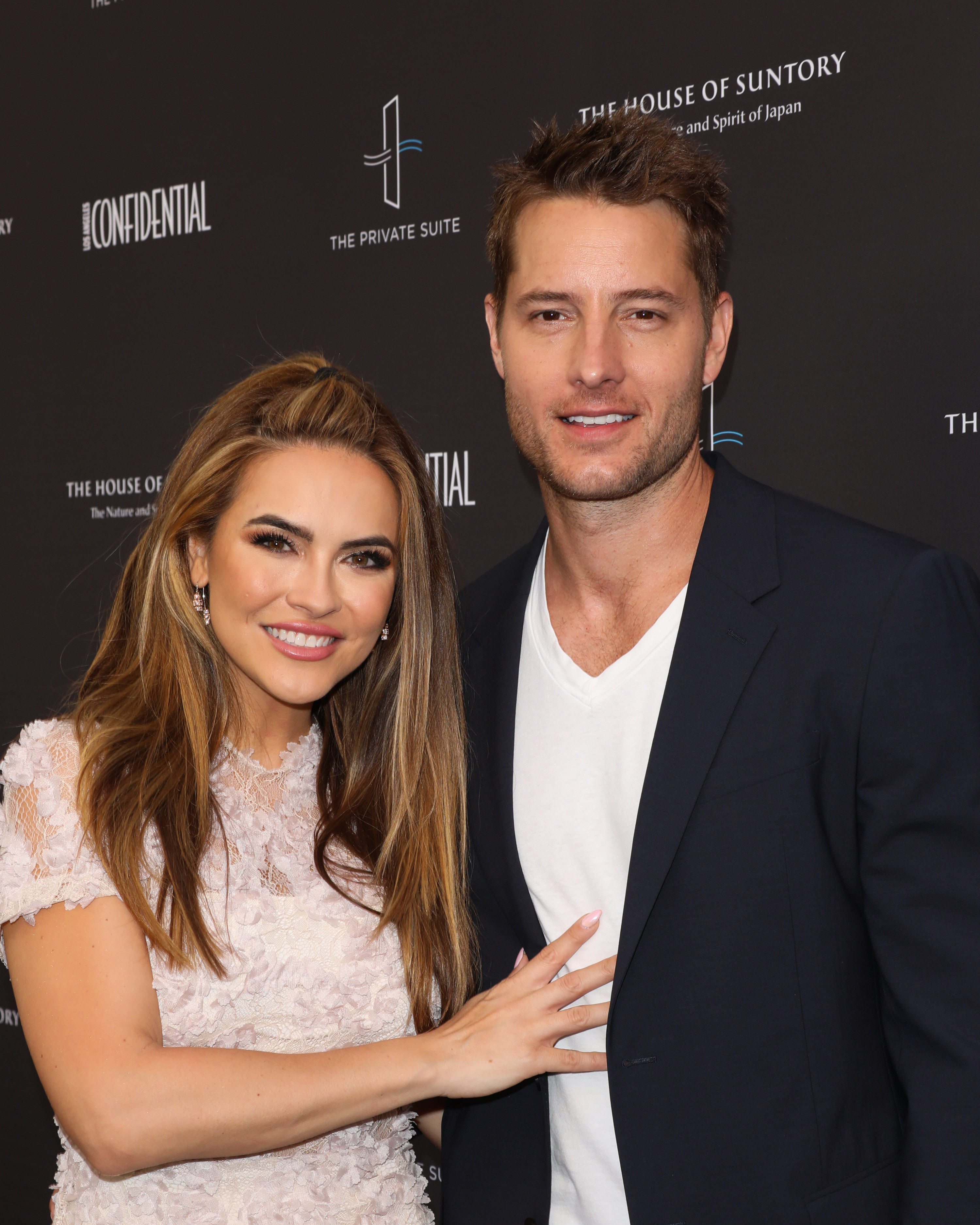 Chrishell Stause and Justin Hartley attend Los Angeles Confidential Magazine Impact Awards in 2019.