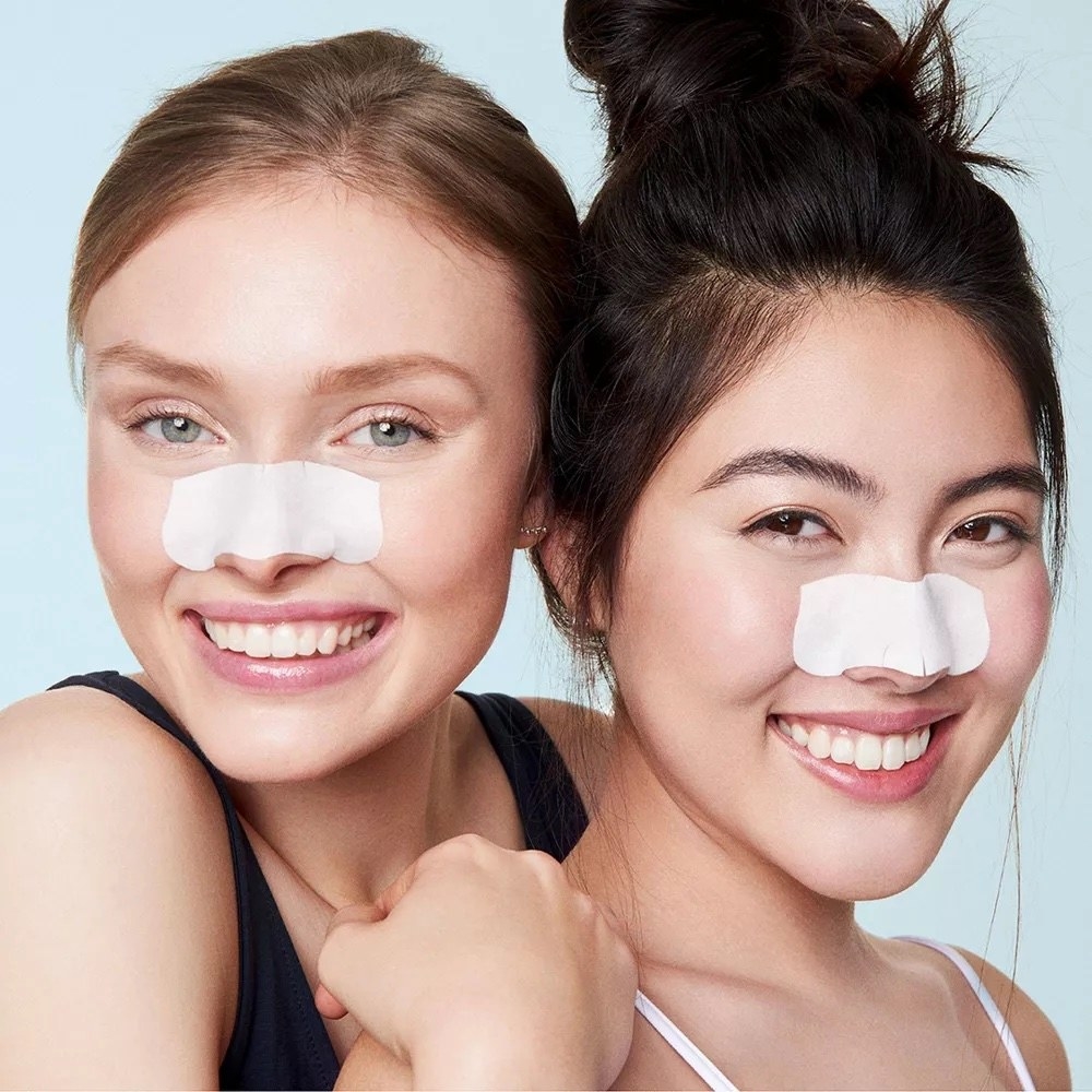 Two model using the pore strip on the nose