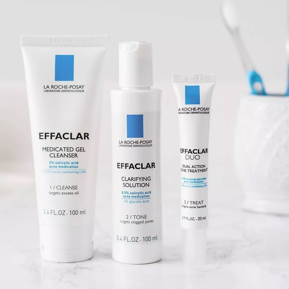 A set of three blue and white cleansing products