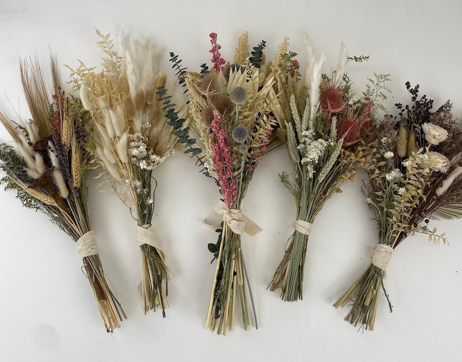 Five dried flower arrangements