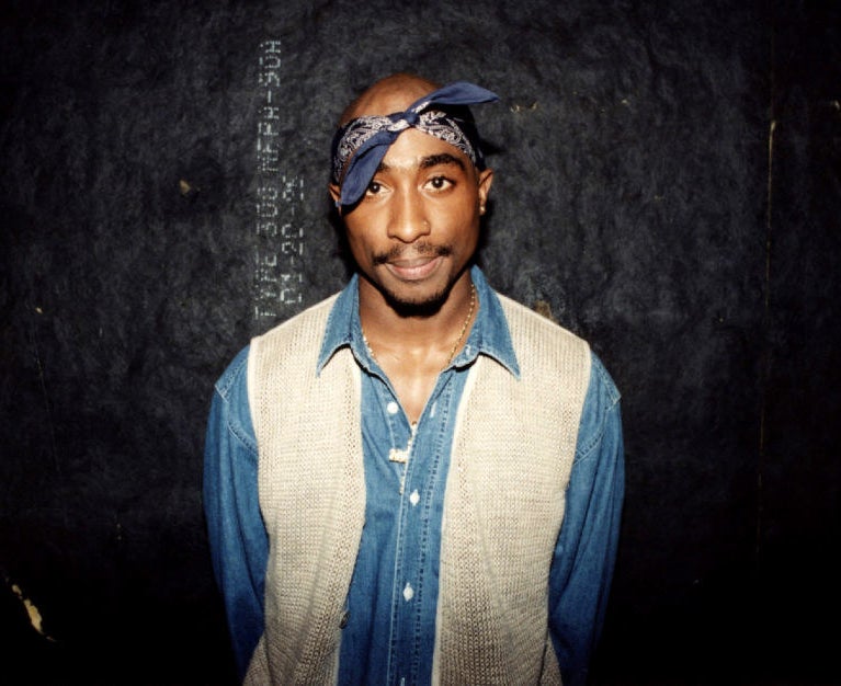 Tupac Shakur poses for photos backstage after his performance at the Regal Theater