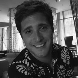 Diego Boneta smiles at the camera in a video for Vogue
