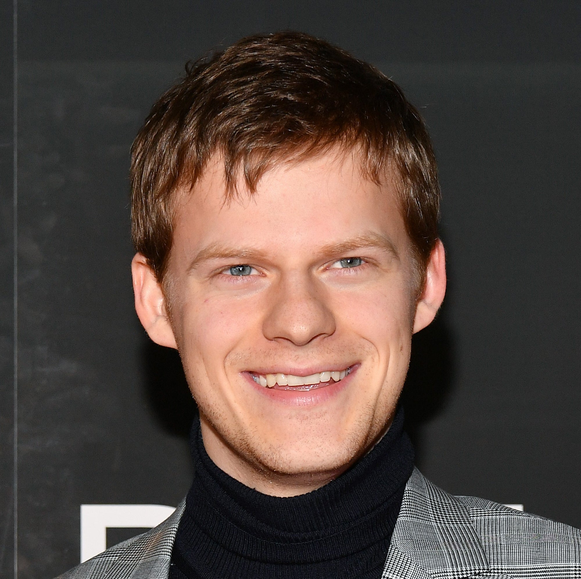 Close-up of Lucas Hedges smiling at the Ben Is Back New York premiere at AMC Loews Lincoln Square