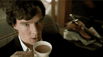 Sherlock blows on a cup of tea