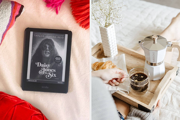a kindle on a bed, a tray with an espresso maker and coffee and croissant on it