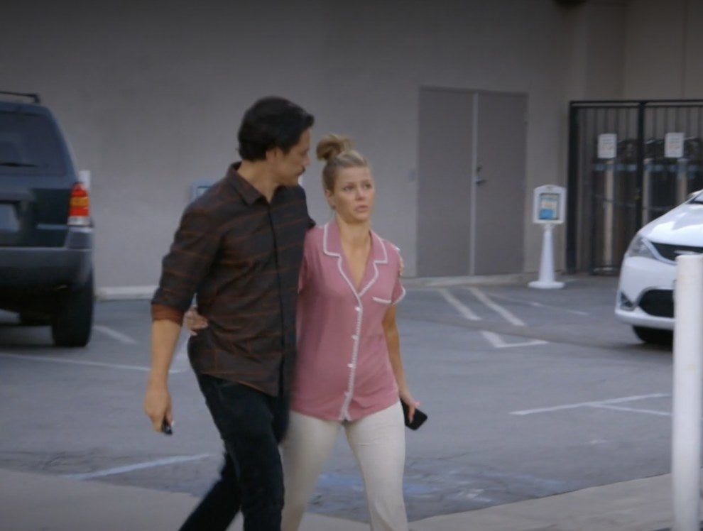 Tom Sandoval and Ariana walking in a parking lot with their arms around each other
