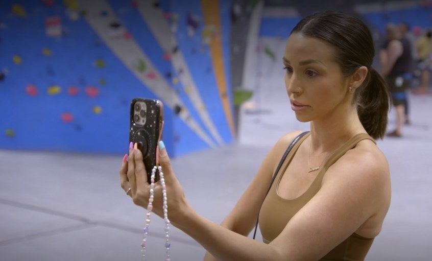 Scheana FaceTiming on her phone