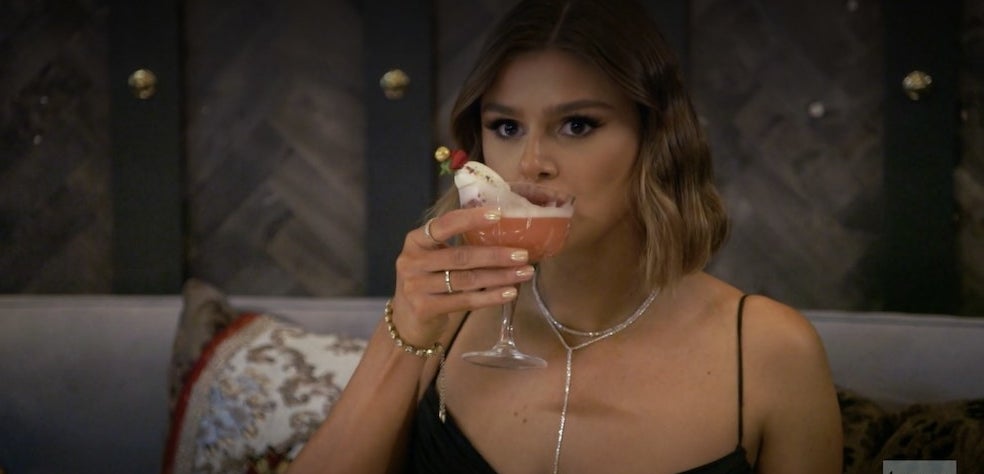 Raquel sipping her elaborate cocktail