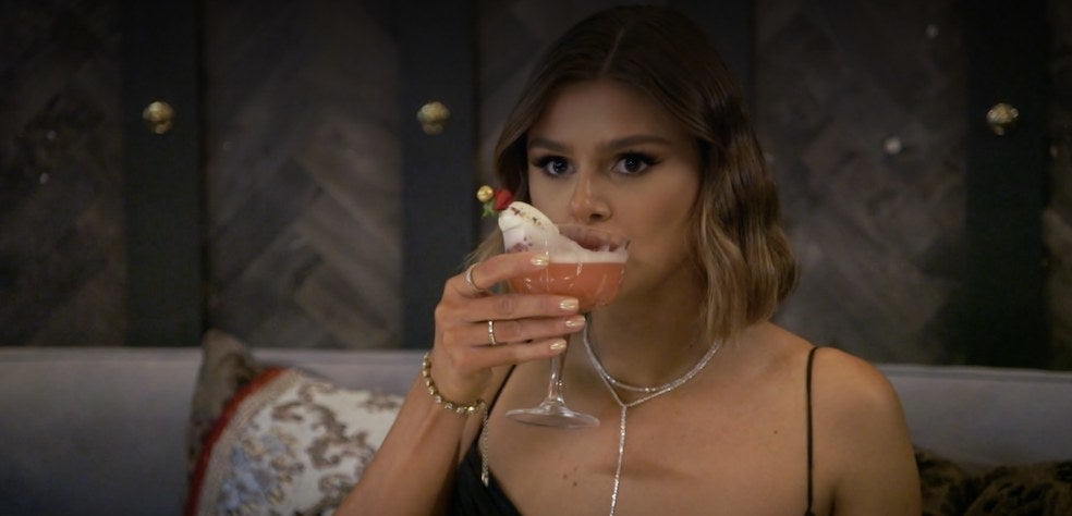 Raquel sipping her elaborate cocktail