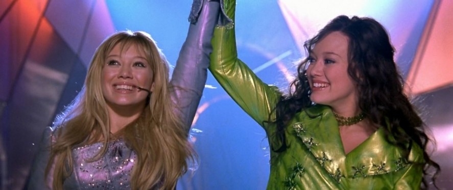 scene from the movie where Lizzie and Isabella performs on stage