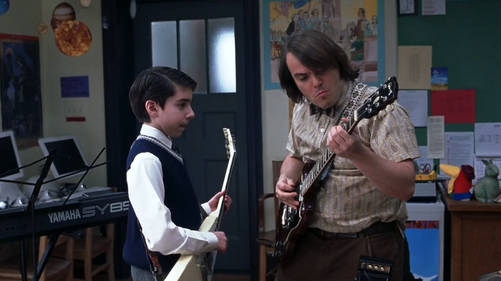 scene from the movie where the music teacher is teaching guitar to a student
