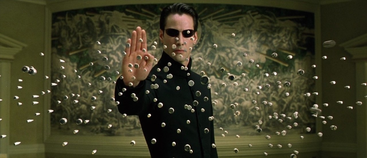scene from the movie where he stops all the bullets with his hand