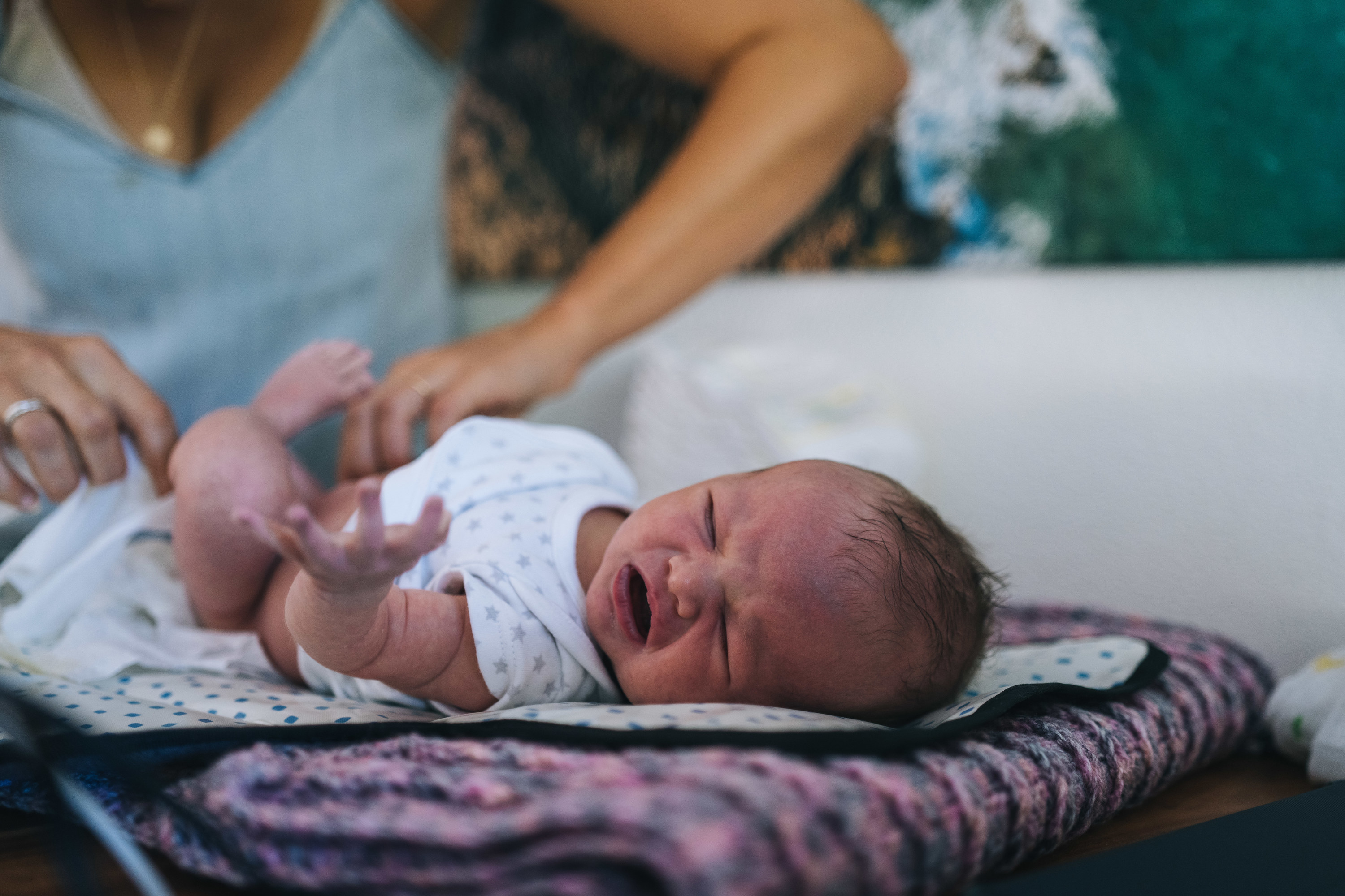 baby being changed on a changing table